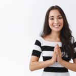 Tender, cheerful and friendly-looking peaceful young asian woman