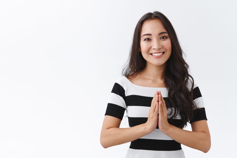 Tender, cheerful and friendly-looking peaceful young asian woman